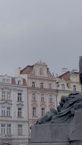 Prague architecture with historic statue on a cloudy day, vertical orientation