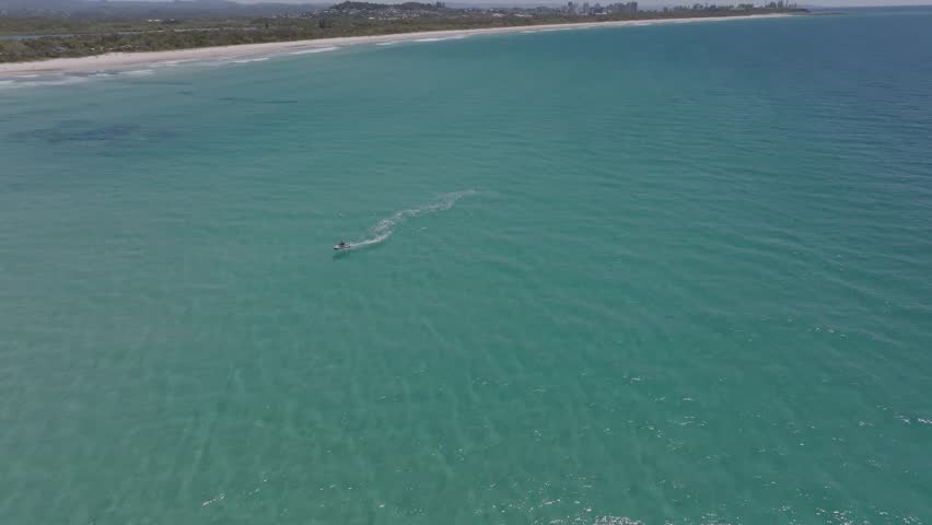 Elevated view of jet ski between Cook Island and Fingal Head causeway, northern New South Wales, Australia