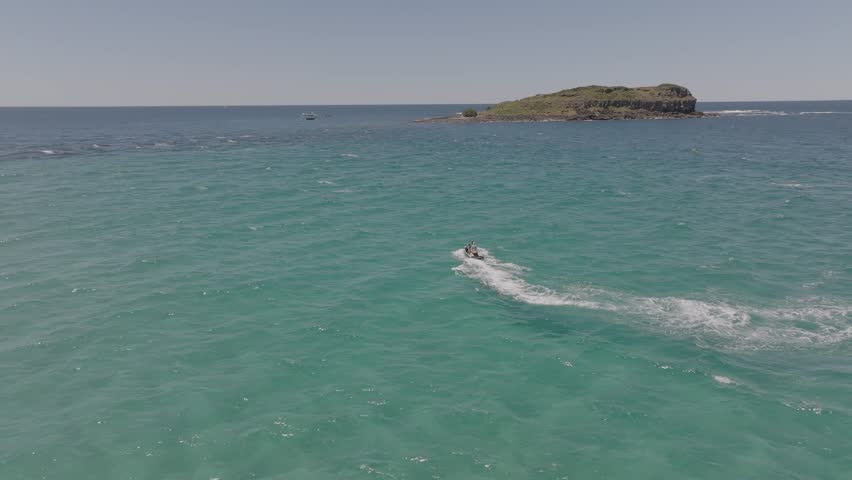 Elevated view of jet ski between Cook Island and Fingal Head causeway, northern New South Wales, Australia