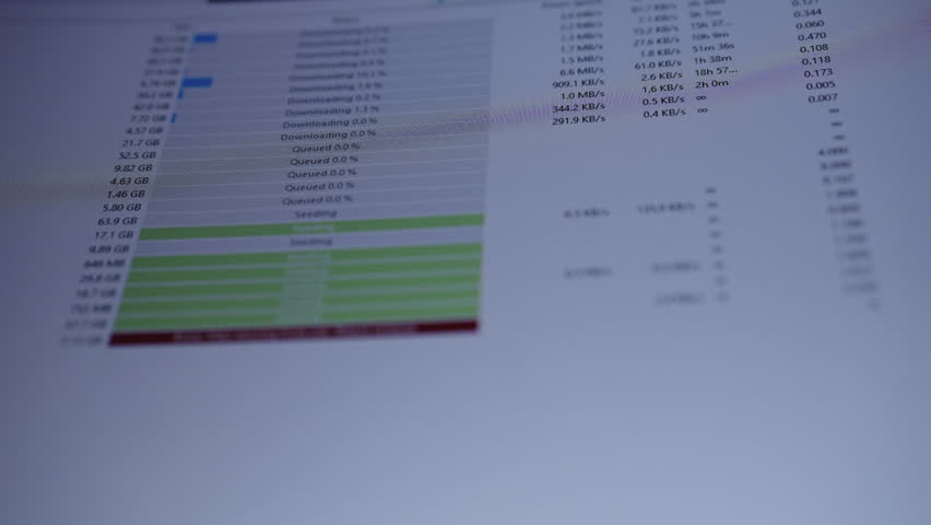 Computer screen showing torrent client seeding and downloading with progress bars and prominent red missing files error, evoking network issues, data loss and troubleshooting, close-up, slow motion.