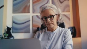 Senior businesswoman reading good news email on laptop about company success - Powered by Shutterstock - Get 15% off with code: PIKWIZARD15