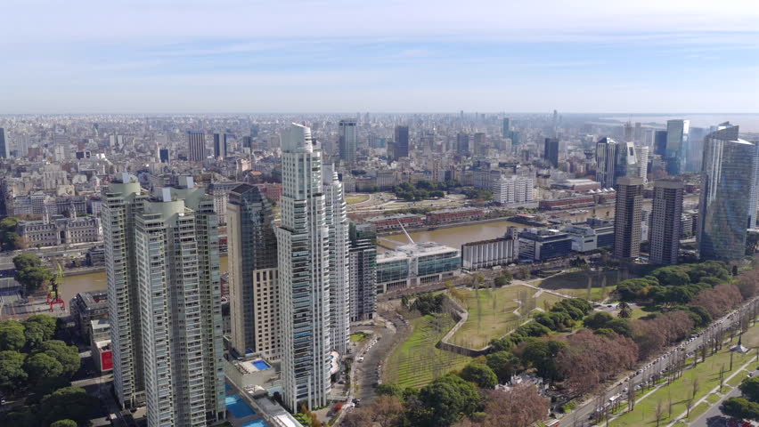 Aerial view of Buenos Aires skyline with tall skyscraper and canal, Argentina