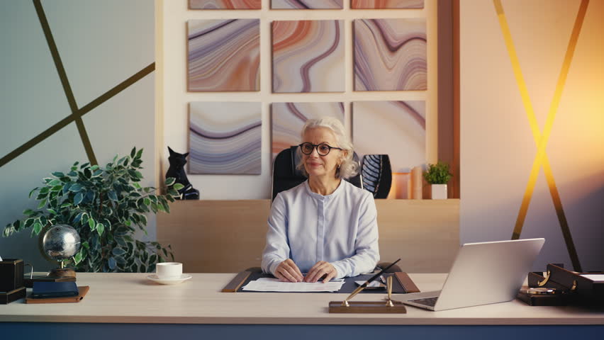 Senior lady HR manager interviewing woman candidate, shaking hands at job