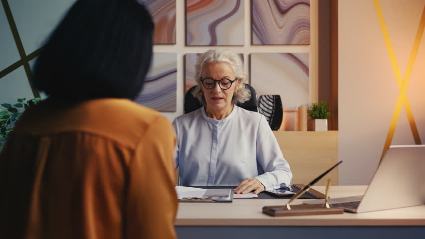 Senior HR manager rejecting applicant after reading CV, employment refusal