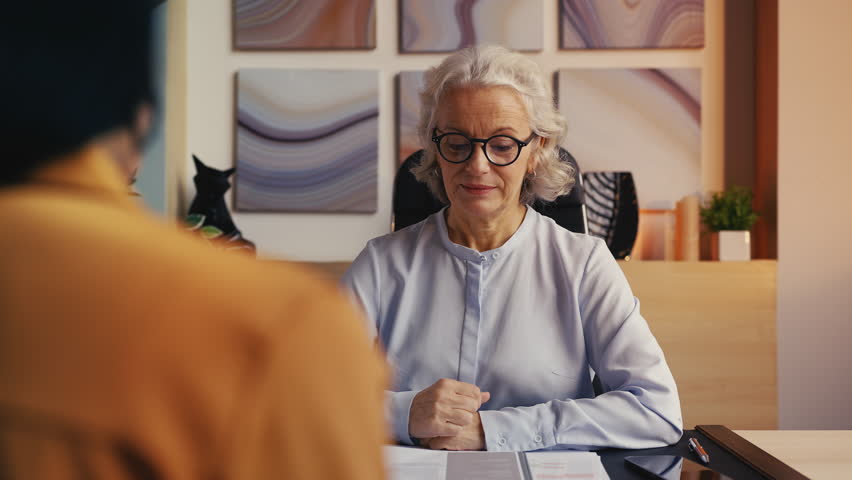 Woman recruiter in her 50s rejecting candidate, unsuccessful job interview