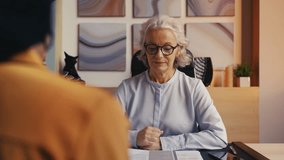 Woman recruiter in her 50s rejecting candidate, unsuccessful job interview - Powered by Shutterstock - Get 15% off with code: PIKWIZARD15