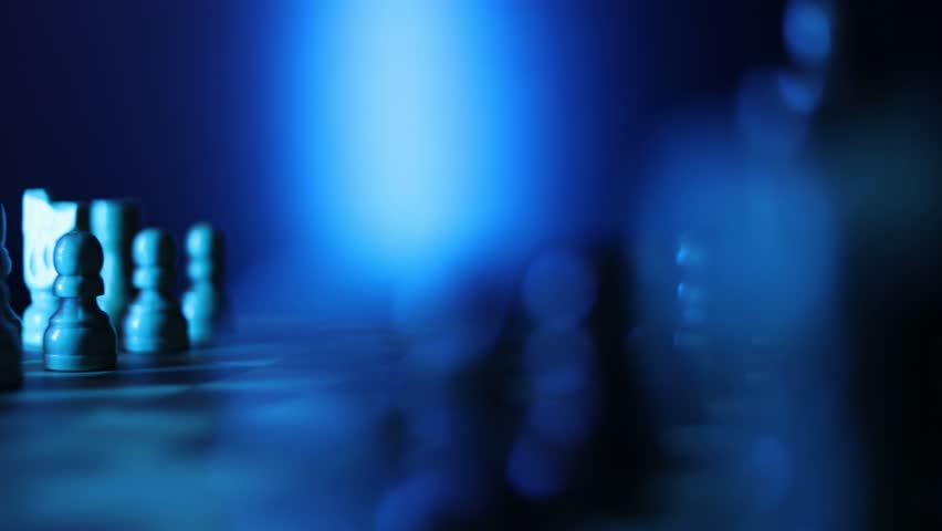 Animated chessboard rotating steadily with chess pieces arranged for play, representing the classic battle between dark and light pieces in intellectual competition, Semi-darkness and blue backlight
