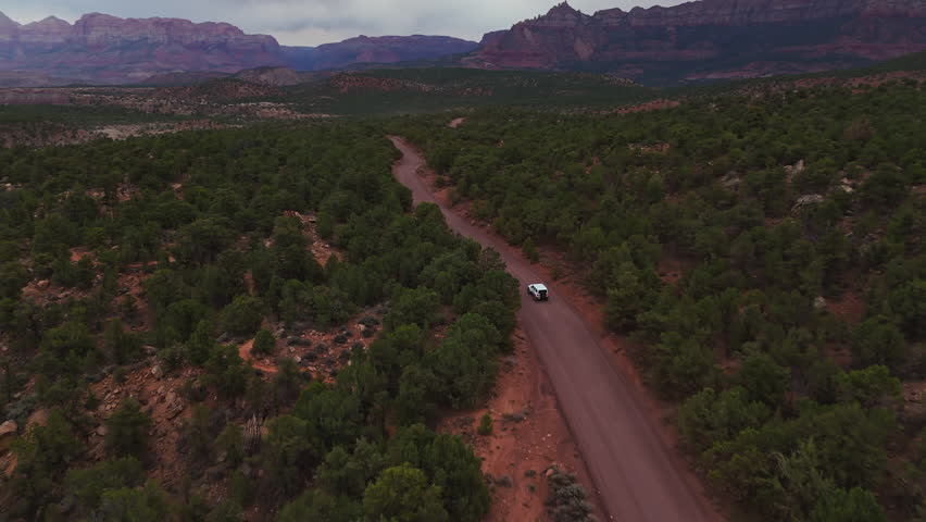 Offroad Vehicle on Dirt Trail Near Red Canyons