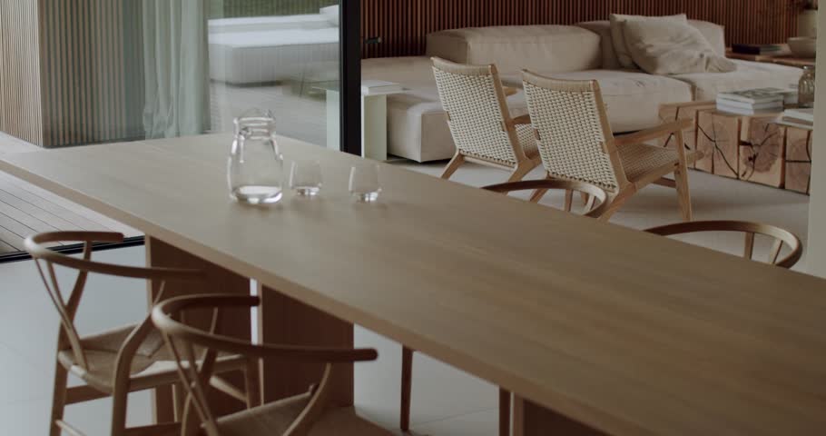 Modern, minimalist dining room interior with natural wood furniture and neutral color palette. dining area with the living room, fostering a sense of togetherness and connection.