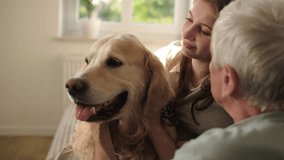 Happy Girl And Grandfather Playing With A Golden Retriever And Petting The Muzzle Of Lovely Pet At Home - Powered by Shutterstock - Get 15% off with code: PIKWIZARD15