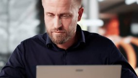 Man Using Phone To Send Voice Message While Working On Laptop - Powered by Shutterstock - Get 15% off with code: PIKWIZARD15