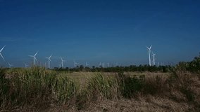 Wind turbines in industrial windmill farm for alternative green energy - Powered by Shutterstock - Get 15% off with code: PIKWIZARD15