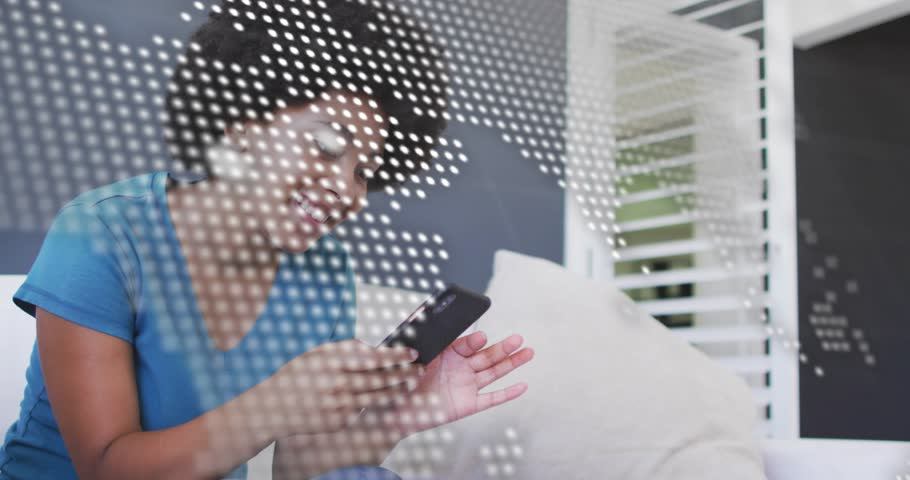 Woman sitting on couch, dotted map overlay and code shifting, revealing tapping phone for tech demo. Mobile, touch, swipe, engagement, minimalist, modern, home