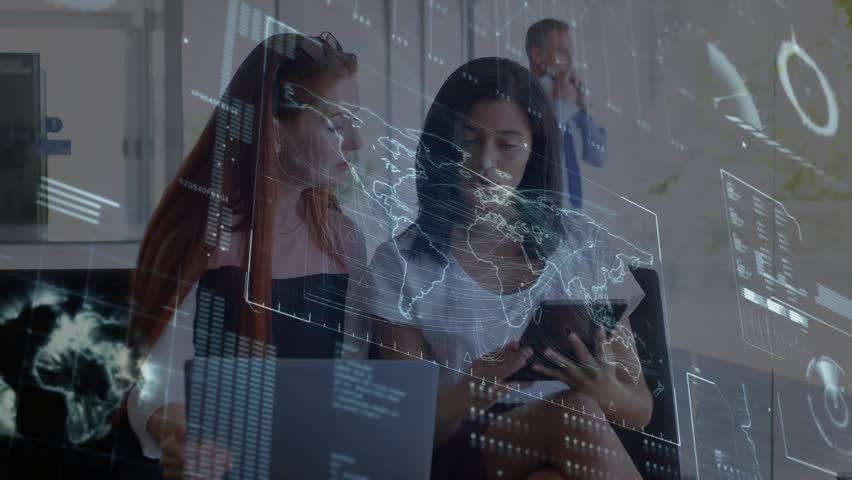 Two women in tech, lead scrolling tablet activating map and charts, peer reviewing laptop data. Collaboration, meeting, office, modern, glass, holographic, analytics - Powered by Shutterstock - Get 15% off with code: PIKWIZARD15