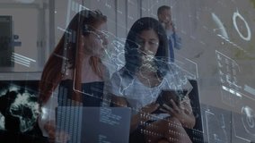 Two women in tech, lead scrolling tablet activating map and charts, peer reviewing laptop data. Collaboration, meeting, office, modern, glass, holographic, analytics - Powered by Shutterstock - Get 15% off with code: PIKWIZARD15
