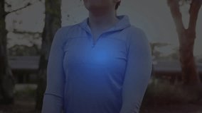 Woman standing in park helix appearing then sweeping across face, blue particles visualizing health. Outdoor, nature, serenity, glow, bokeh, overlay, futuristic - Powered by Shutterstock - Get 15% off with code: PIKWIZARD15