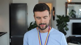 Proud man waving a fan with rainbow colours  - Powered by Shutterstock - Get 15% off with code: PIKWIZARD15
