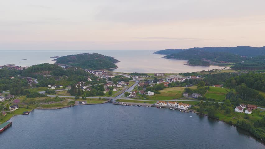 Aerial panorama of coastal town and islands in southern Norway with calm sea