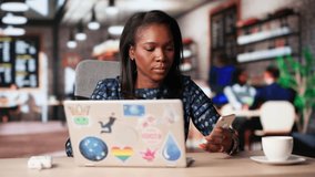 Budget Planning For African American Woman At Coffee Shop - Powered by Shutterstock - Get 15% off with code: PIKWIZARD15