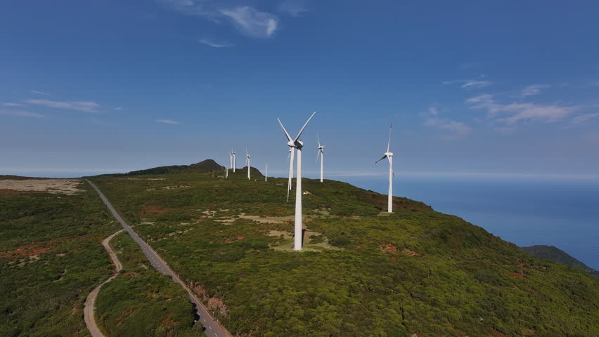 Aerial view of turbines overlooking calm ocean, Location plan displaying wind turbines and road alignment from above