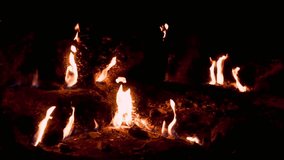 Billowing flames emerge from the earth in a dark landscape - Powered by Shutterstock - Get 15% off with code: PIKWIZARD15