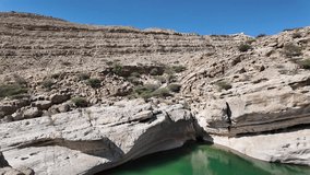 Wadi Bani Khalid is a popular tourist destination in Oman, known for its lush oasis, clear turquoise pools, and rugged mountain scenery.
 - Powered by Shutterstock - Get 15% off with code: PIKWIZARD15