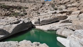Wadi Bani Khalid is a popular tourist destination in Oman, known for its lush oasis, clear turquoise pools, and rugged mountain scenery.
 - Powered by Shutterstock - Get 15% off with code: PIKWIZARD15