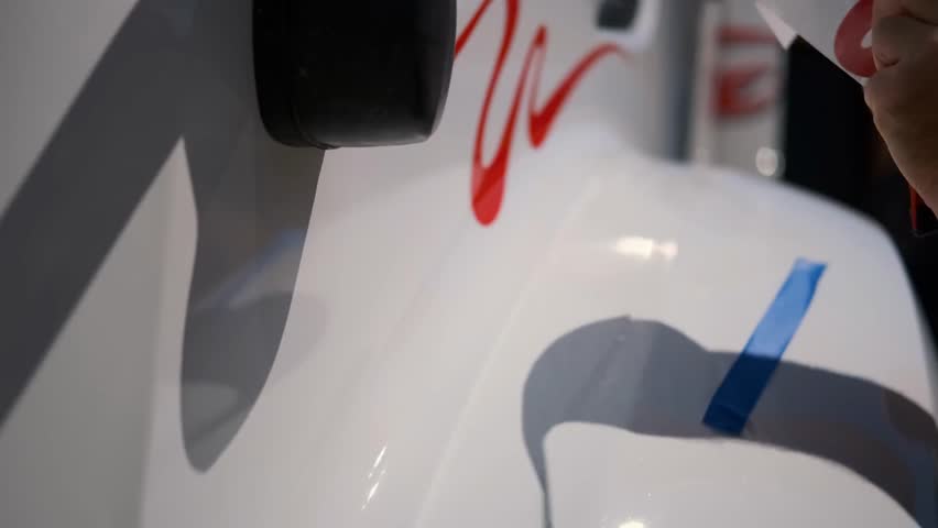 Applying Vinyl Logos on Vehicles, Capturing Vehicle Branding, Customization Process, and Professional Signage Installation