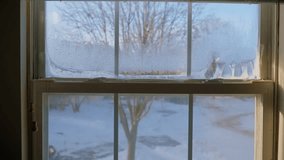 Wide shot of condensed ice bubbles forming on old home windows, capturing winter textures, frosted glass patterns, and cold seasonal atmosphere. - Powered by Shutterstock - Get 15% off with code: PIKWIZARD15