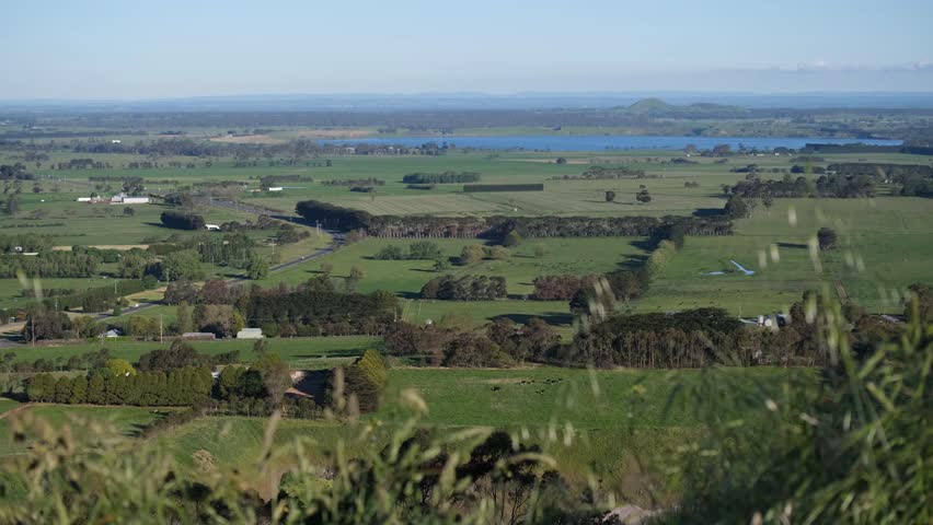 Panoramic view from the Mt Leura Lookout near Camperdown in Victoria, Australia, overlooking the Western Victorian Volcanic Plains. Rolling farmland, crater lakes create a peaceful regional landscape.