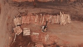 Aerial view of industrial timber yard with stacked logs arranged in rows. - Powered by Shutterstock - Get 15% off with code: PIKWIZARD15