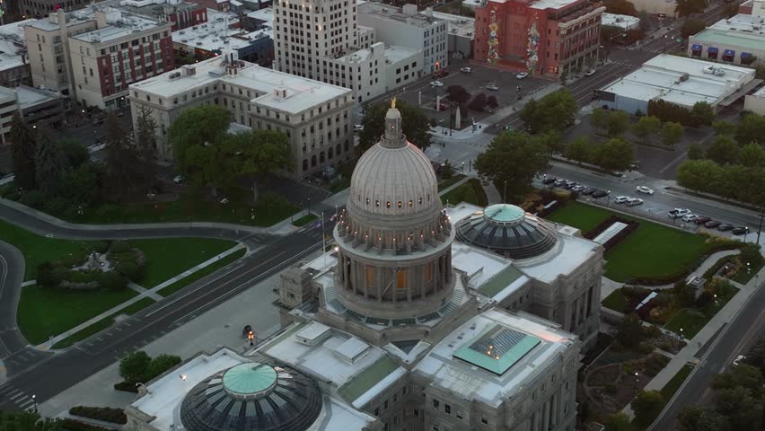 Close aerial of Idaho State Capitol Building at dusk in downtown Boise