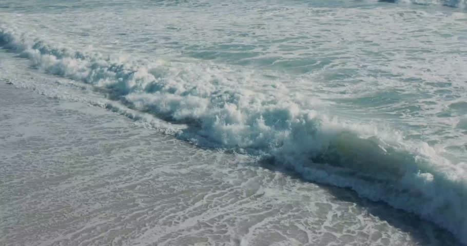 Stunning footage capturing the iconic Table Mountain of Cape Town as seen from a sandy beach shore.  Perfect for travel films, tourism promotions, nature documentaries, and cinematic landscape visuals