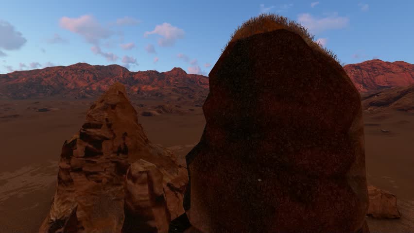 Towering red desert rock formations tracking past, revealing arid terrain and distant mountains under a blue sky at sunset.