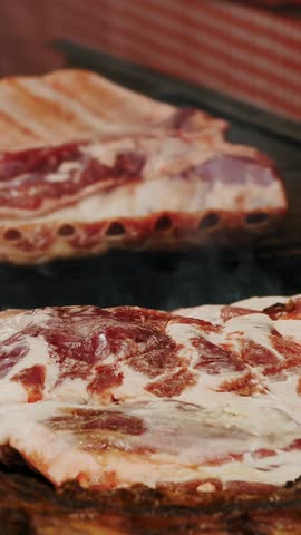 Meat. street food. close-up. grilled meat. Barbecue. fair. food festival. Outdoor cooking. Meat on skewers. Meat on the bone. street market. culinary exhibition or fair.