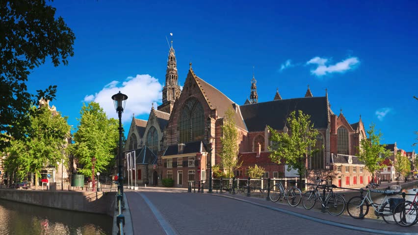 AMSTERDAM, NETHERLANDS   Dutch protestant Western Church located at the Old Central district in AmsterdamHyperlapse of Amsterdam