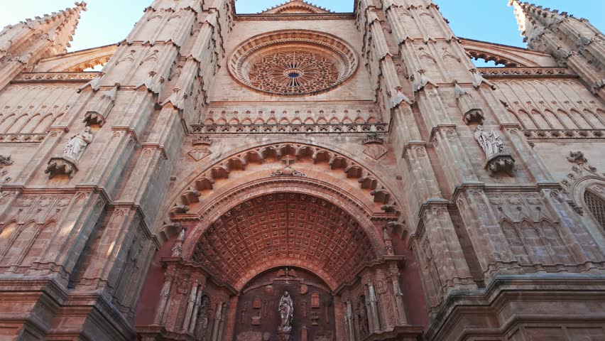 Beautiful facade of the Cathedral of Santa Maria of Palma in Palma de Mallorca, Balearic Islands, Spain. Impressive Gothic architecture with intricate stone carvings, a landmark of Majorca island