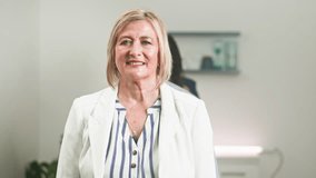 Happy Diverse Business Team Smiles Confidently, Showcasing Professional Teamwork and Collaboration in an Office - Powered by Shutterstock - Get 15% off with code: PIKWIZARD15