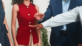 Diverse Business Team Celebrates Success with United Hands, Fostering Collaboration and Teamwork in the Office - Powered by Shutterstock - Get 15% off with code: PIKWIZARD15