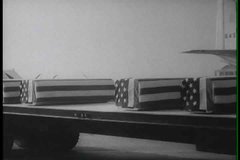 1960s - Flag draped coffins return from Vietnam during the war.