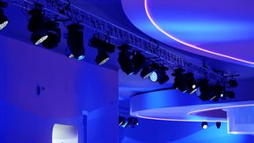 Exhibition blue and violet lighting stage spotlights illuminating modern event space - Powered by Shutterstock - Get 15% off with code: PIKWIZARD15