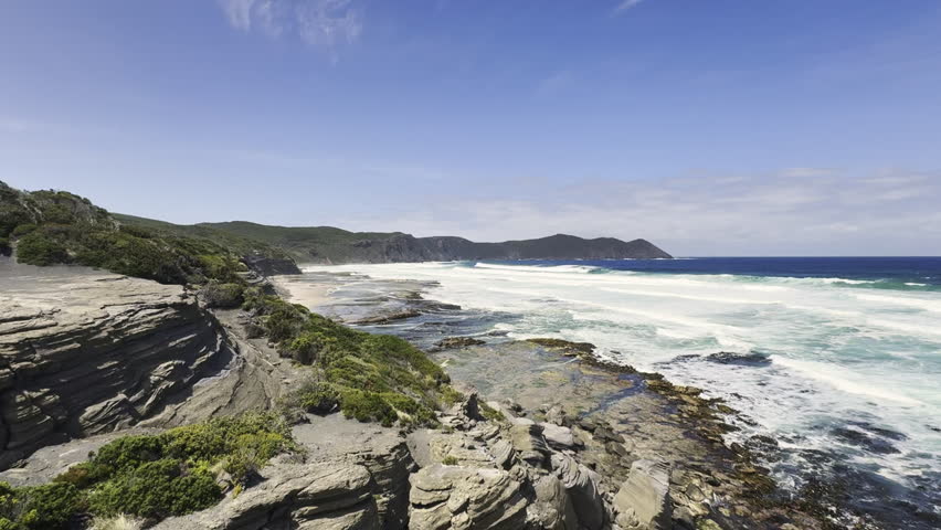 sandy beach along the coastline of the Tasman sea near cockle creek the southernmost point of Tasmania, Australia, a popular travel destination for hiking and camping.