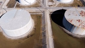 A detailed aerial animation of storage tanks at an oil refinery, showcasing industrial infrastructure and energy production facilities. - Powered by Shutterstock - Get 15% off with code: PIKWIZARD15