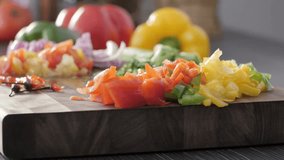 a close up shot of a wooden board with diced vegetables, including peppers, tomatoes, and onions, ready for cooking. a colorful and fresh food preparation scene. - Powered by Shutterstock - Get 15% off with code: PIKWIZARD15