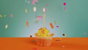 Colorful confetti falling on a cupcake topped with a lit candle. Perfect for birthday celebrations, party invitations, festive animations, bakery promotions, and joyful event visuals. - Powered by Shutterstock - Get 15% off with code: PIKWIZARD15