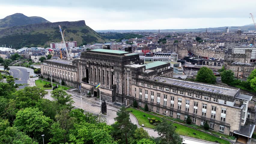 Overlook from Calton Hill showing Scottish Government building and Edinburgh cityscape on an overcast day