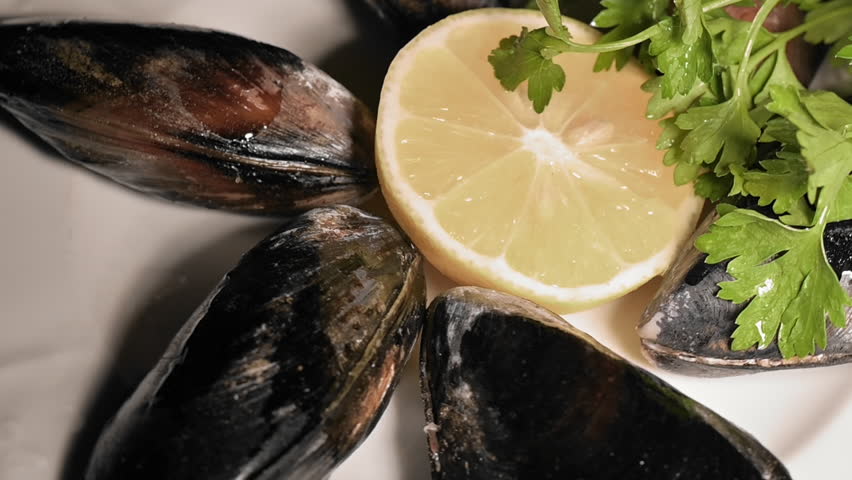 Close-Up Stuffed Mussels On A Plate.