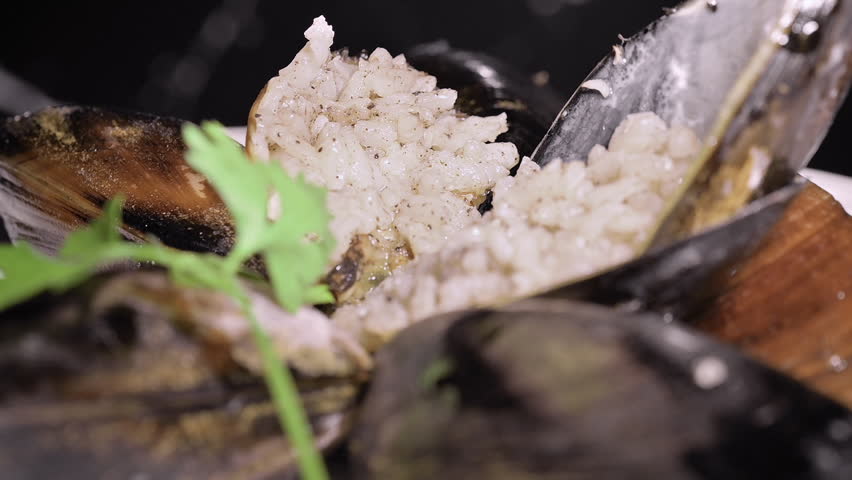 Close-Up Stuffed Mussels On A Plate.