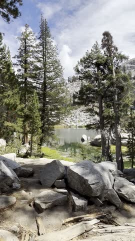 scenic landscapes and hiking trails of Sequoia National Park, featuring forested pathways, mountain views, rocky terrain, and the peaceful natural beauty that defin