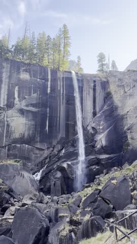 Vertical video showing the wide, scenic vistas of Yosemite Valley, with granite walls, green meadows, and dense forest stretching across the iconic California landscape.